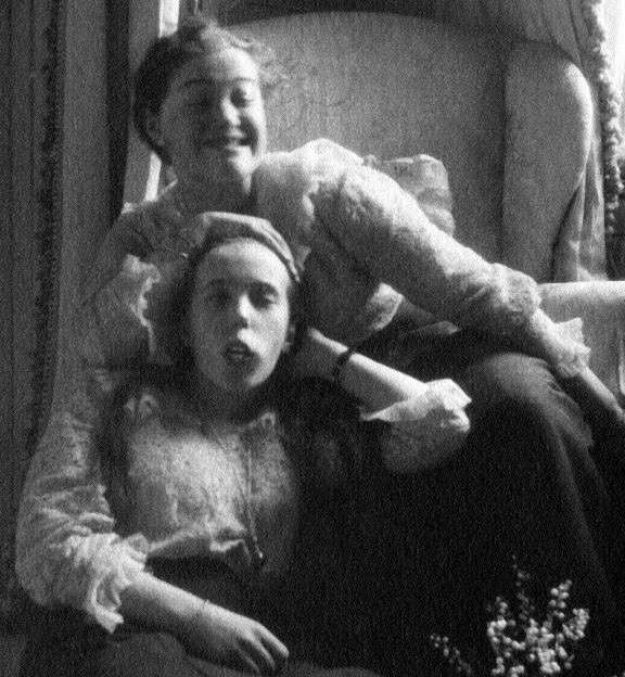 Grand Duchesses Maria and Anastasia making faces for the camera in Tsarskoye Selo, around 1917