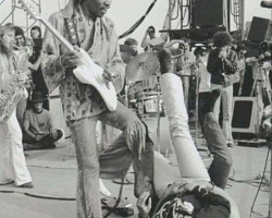 A female fan tries to get to JIMI HENDRIX onstage at the Newport ‘69 Pop Festival at Devonshire Downs in Northridge, California, June 22, 1969.